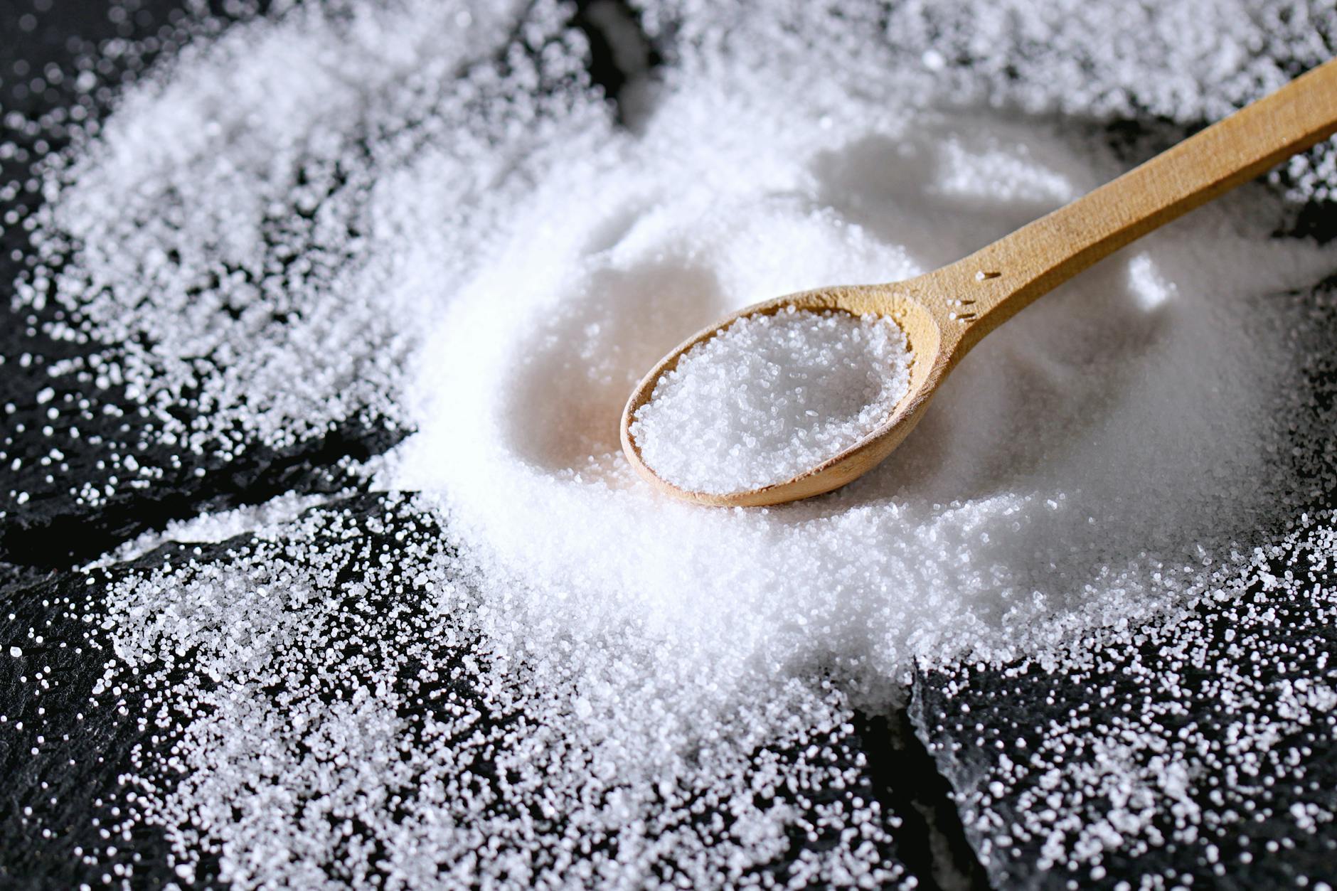 close up shot of a wooden spoon and salt